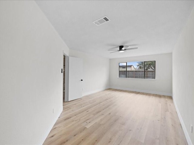 unfurnished room featuring ceiling fan and light wood-type flooring