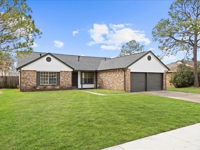 ranch-style house with a garage and a front lawn