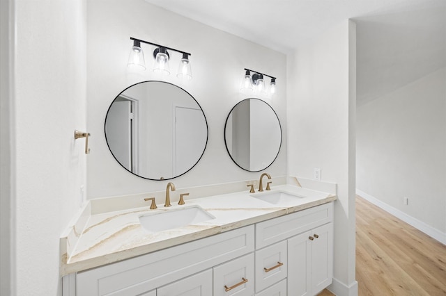 bathroom featuring vanity and wood-type flooring