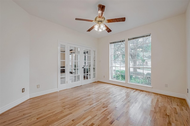 unfurnished room with french doors, ceiling fan, and light wood-type flooring