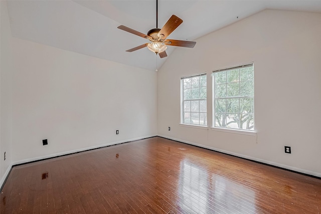 spare room featuring lofted ceiling, hardwood / wood-style floors, and ceiling fan