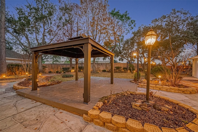 deck at dusk with a gazebo