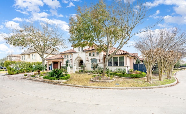 mediterranean / spanish-style house featuring a garage