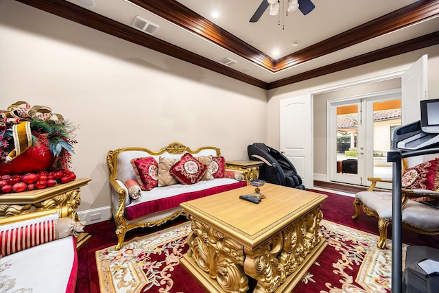 living area featuring crown molding and ceiling fan