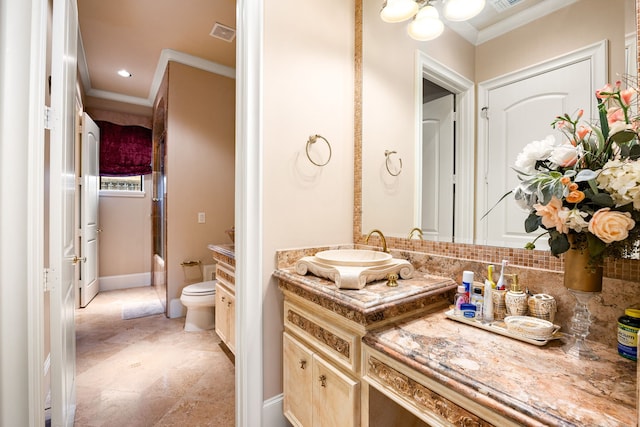 full bathroom featuring shower / bath combination with glass door, vanity, ornamental molding, decorative backsplash, and toilet