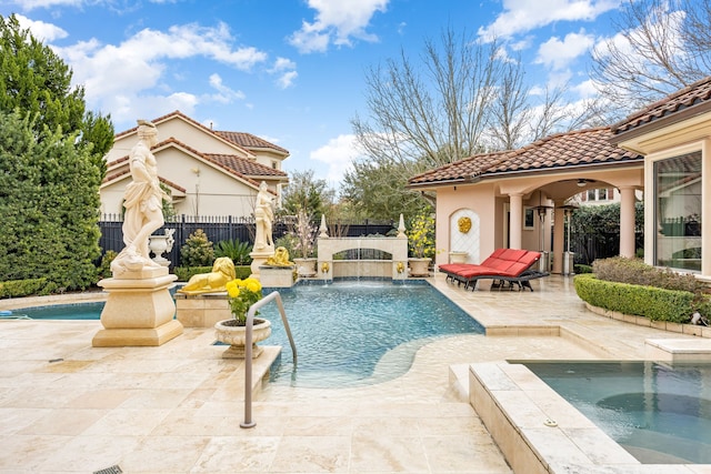 view of pool featuring an in ground hot tub and a patio