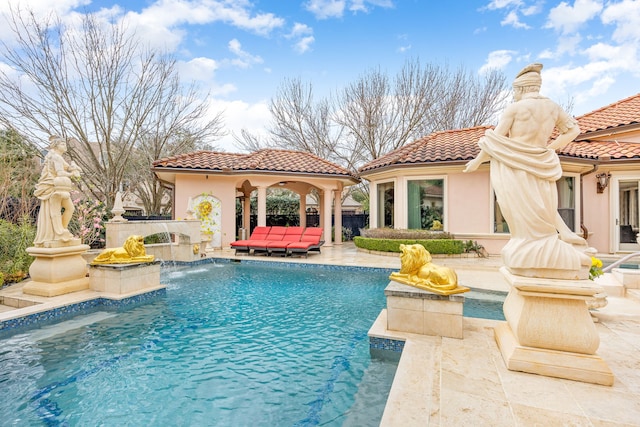 view of pool with outdoor lounge area, an outdoor structure, and a patio area