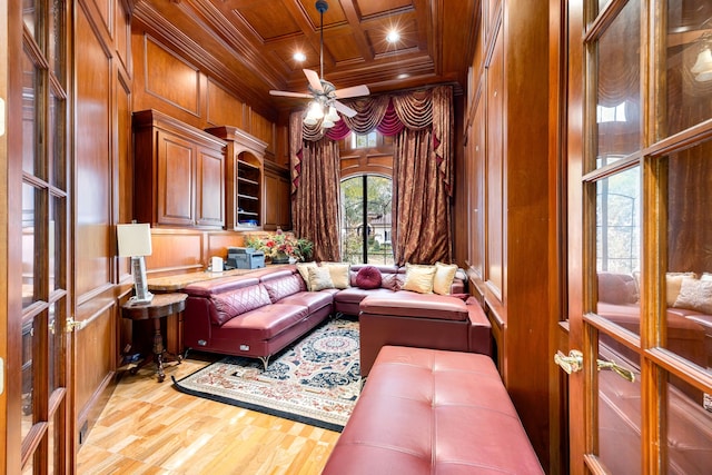 home office with wood ceiling, hardwood / wood-style floors, wooden walls, coffered ceiling, and ornamental molding