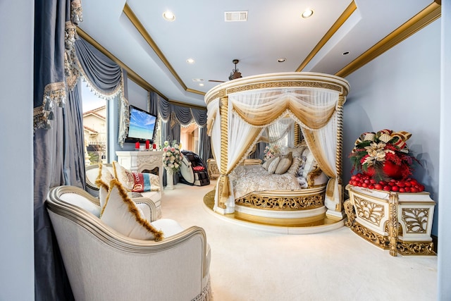 sitting room featuring ornamental molding, a tray ceiling, and carpet