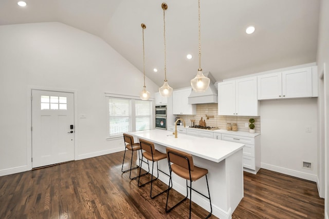 1819 Studewood St, Houston, TX 77008 - kitchen featuring premium range hood, high vaulted ceiling, recessed lighting, a breakfast bar area, and appliances with stainless steel finishes