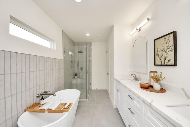 1819 Studewood St, Houston, TX 77008 - bathroom with a stall shower, tile patterned flooring, double vanity, a freestanding tub, and recessed lighting