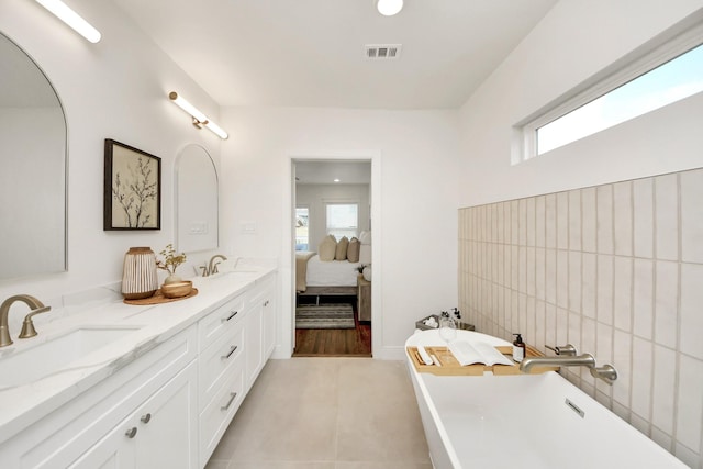 1819 Studewood St, Houston, TX 77008 - bathroom featuring a soaking tub, ensuite bath, and double vanity