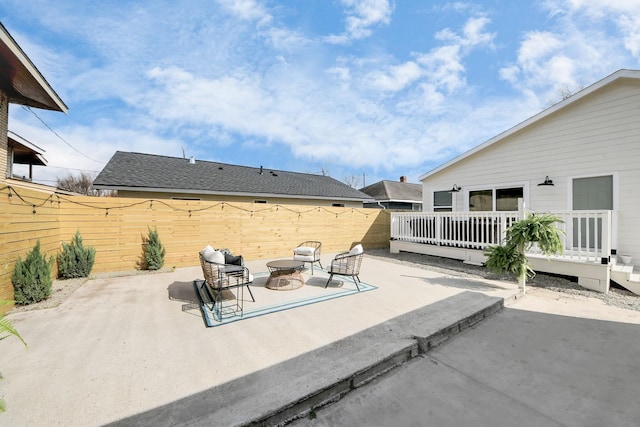 1819 Studewood St, Houston, TX 77008 - view of patio featuring a deck, a fenced backyard, and a fire pit
