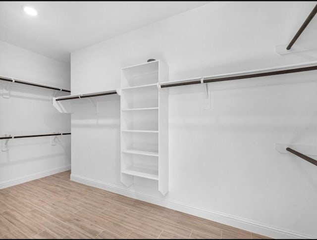 walk in closet featuring light hardwood / wood-style floors