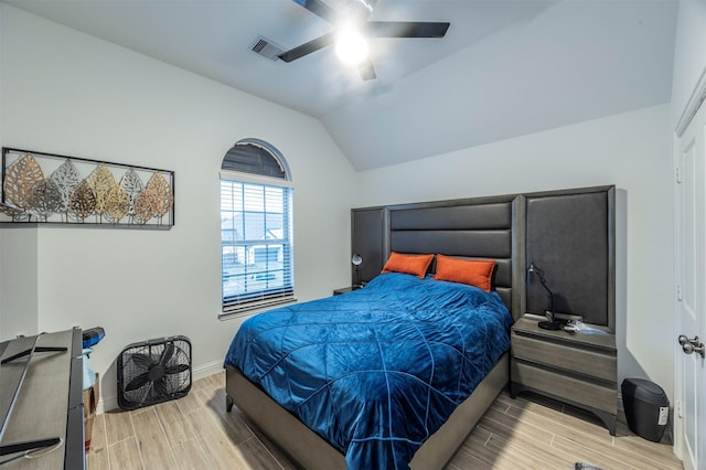 bedroom with ceiling fan and lofted ceiling