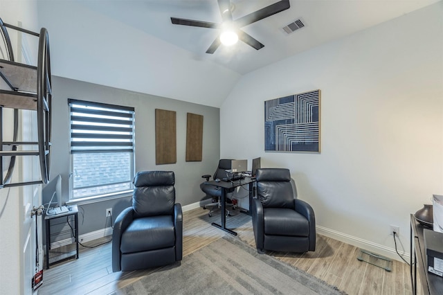 sitting room featuring vaulted ceiling, ceiling fan, and light hardwood / wood-style floors