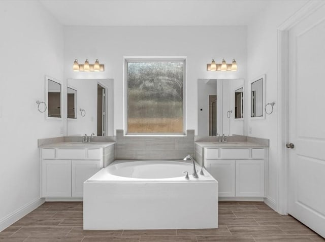 bathroom featuring vanity and a bathing tub