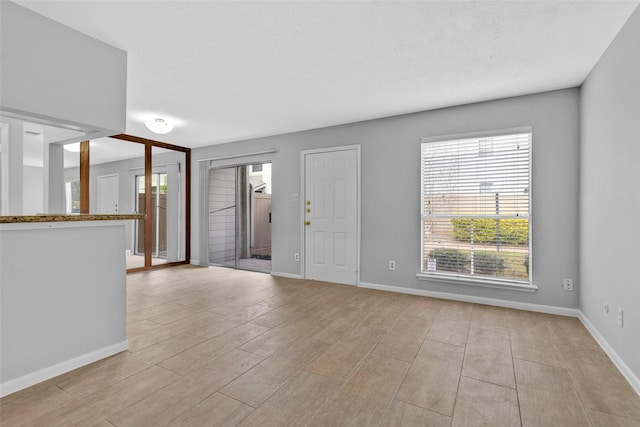 foyer entrance with light wood-type flooring