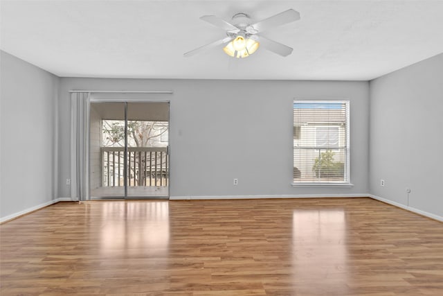 empty room featuring ceiling fan and light wood-type flooring