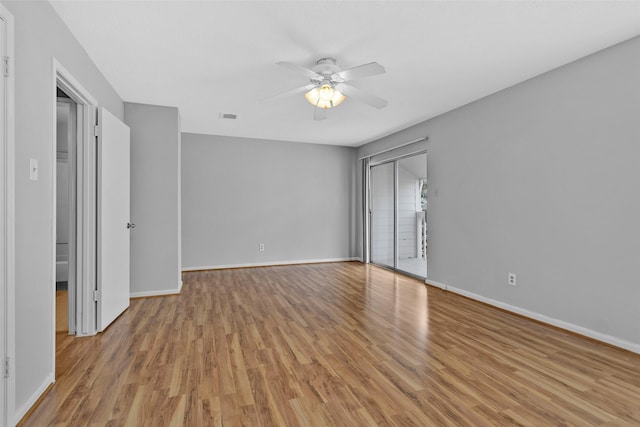 unfurnished room with ceiling fan and light hardwood / wood-style flooring