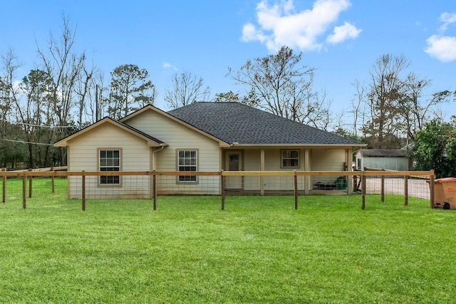 back of house with a yard