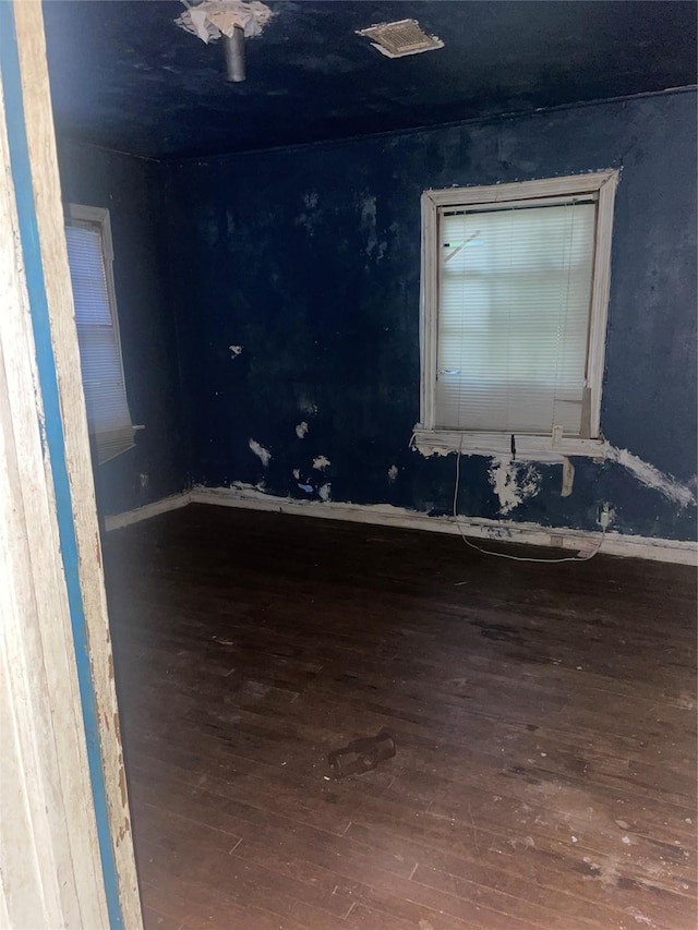 empty room featuring hardwood / wood-style flooring