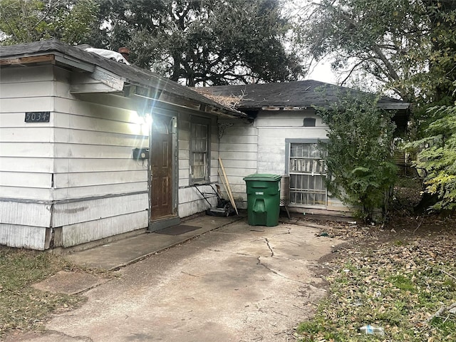 view of property exterior with a patio