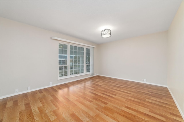 unfurnished room with light hardwood / wood-style flooring