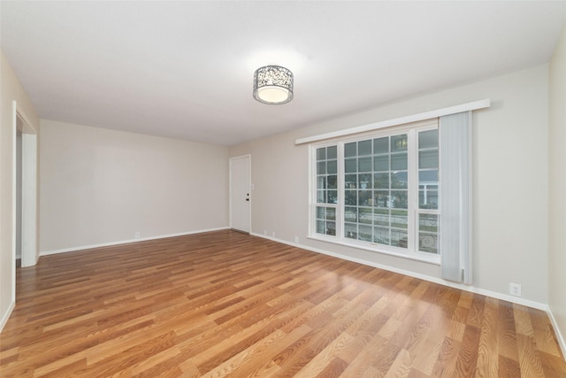 spare room featuring light hardwood / wood-style floors