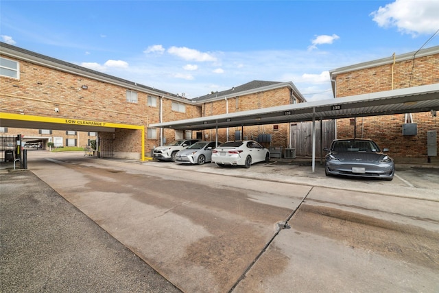 view of vehicle parking with a carport