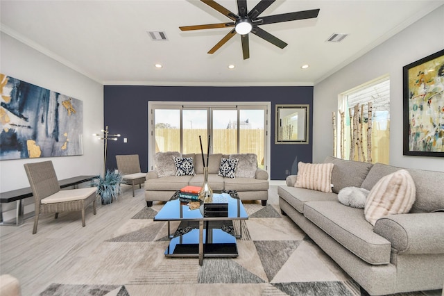 living room featuring ceiling fan and ornamental molding