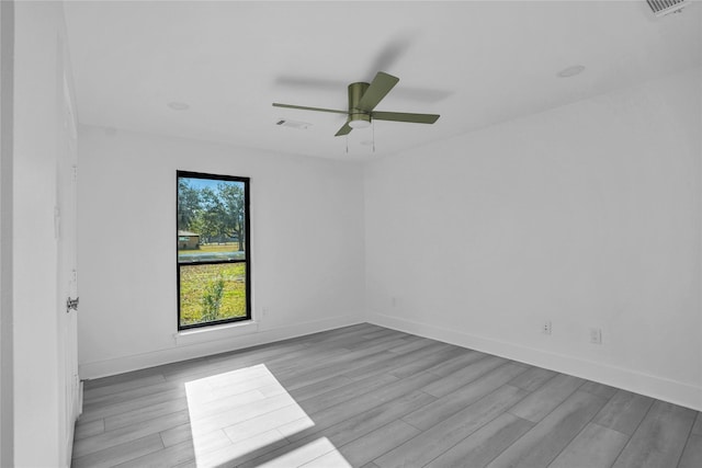 unfurnished room featuring light hardwood / wood-style floors and ceiling fan