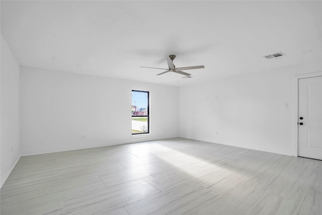 spare room with ceiling fan