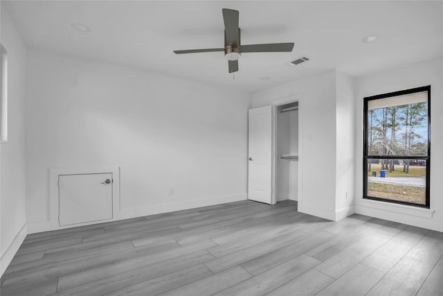 unfurnished room featuring ceiling fan and light hardwood / wood-style floors