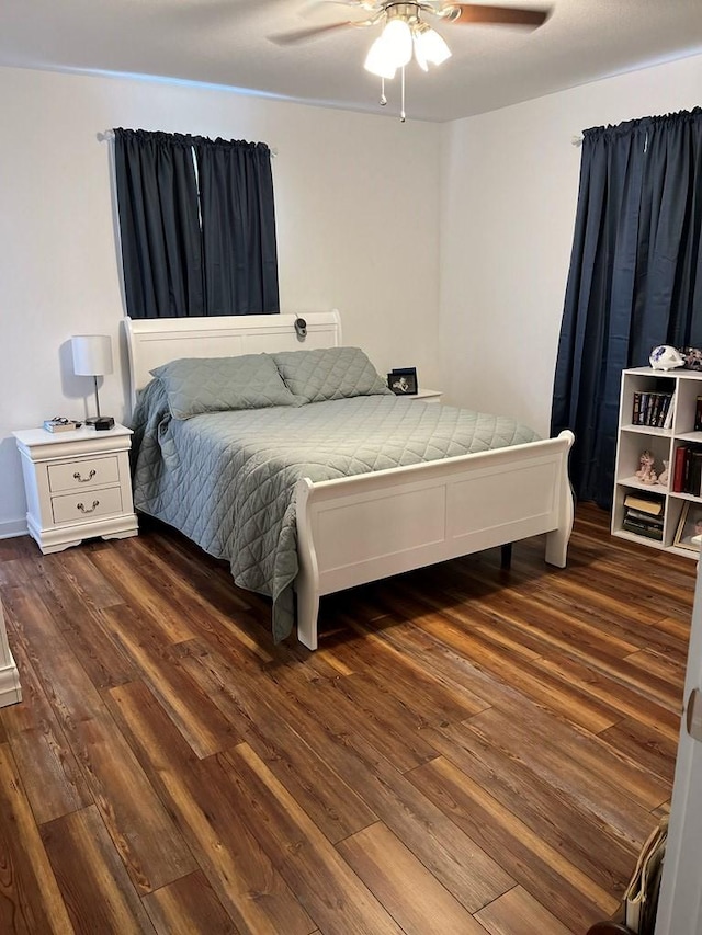 bedroom featuring dark wood-type flooring and ceiling fan