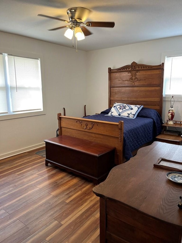 bedroom featuring dark wood-type flooring and ceiling fan