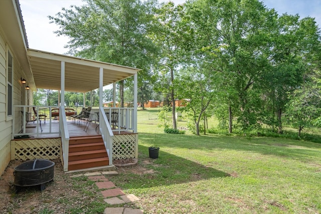 view of yard with a wooden deck