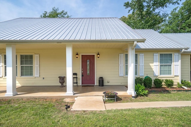 view of front of home with a front yard and a porch