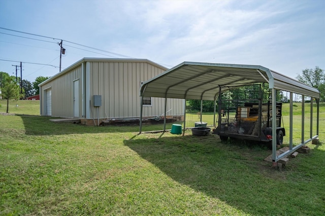 view of outbuilding featuring a garage, a lawn, and a carport