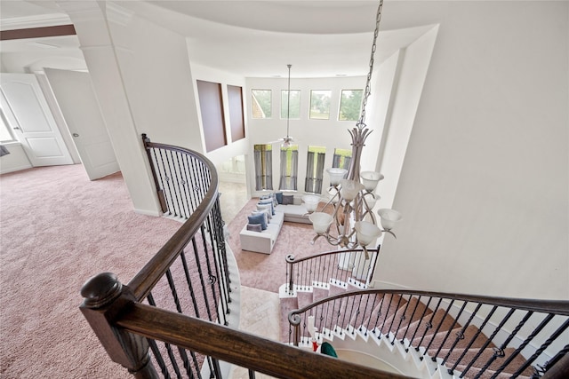 staircase featuring carpet flooring and baseboards