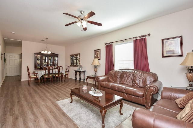 living room featuring hardwood / wood-style flooring and ceiling fan
