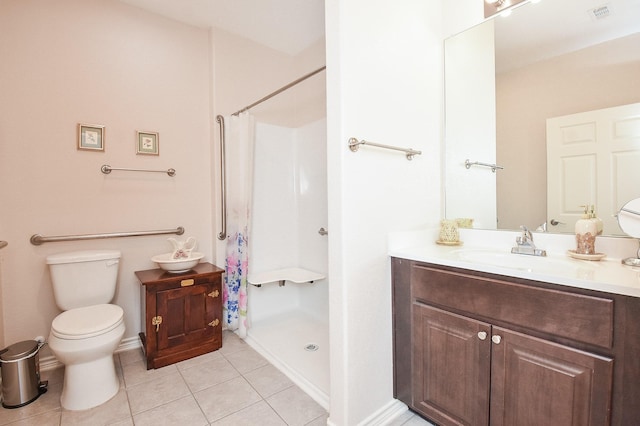 bathroom featuring tile patterned flooring, vanity, curtained shower, and toilet