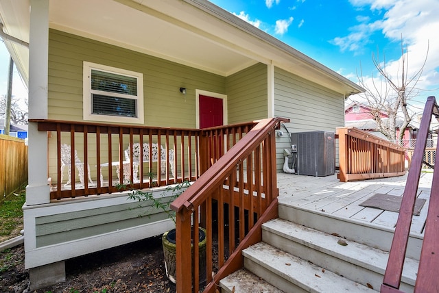 wooden deck with central air condition unit
