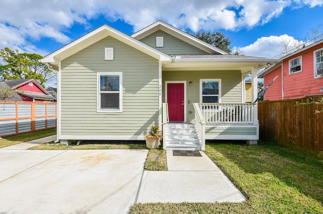 bungalow-style home featuring a front yard and a porch