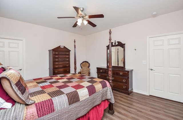 bedroom with hardwood / wood-style floors and ceiling fan