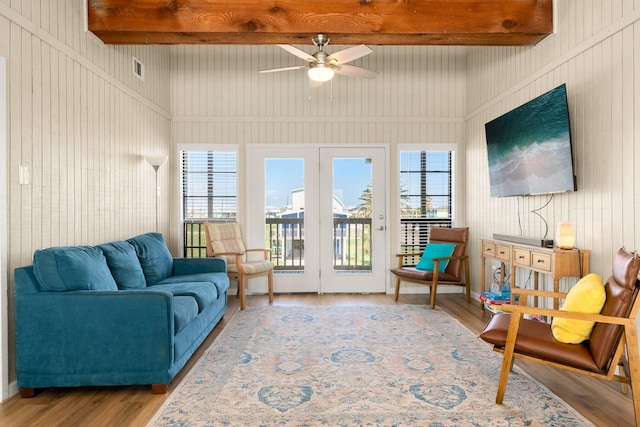 interior space featuring ceiling fan and beamed ceiling