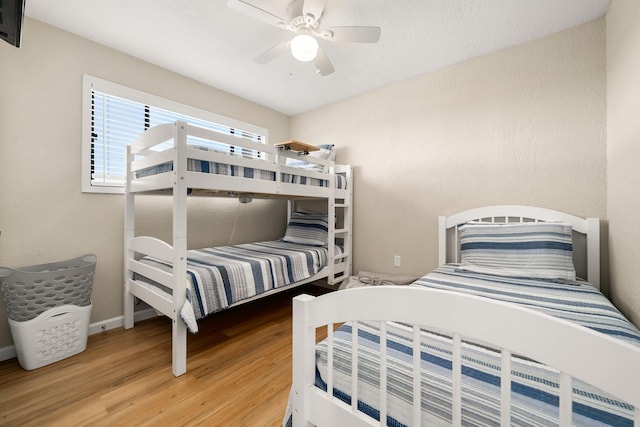 bedroom featuring wood-type flooring and ceiling fan