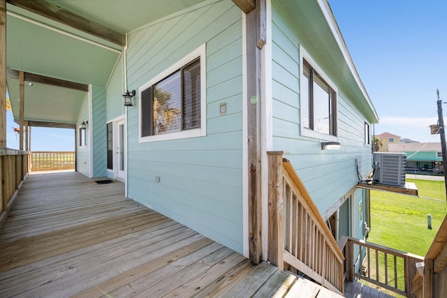 wooden terrace with a yard and central AC