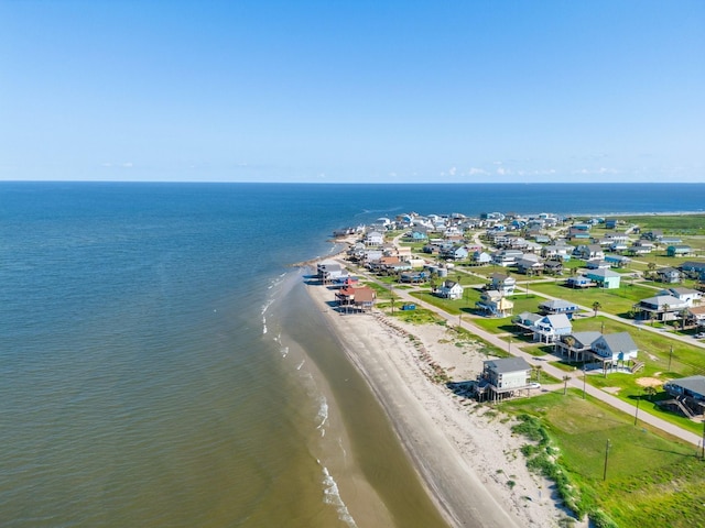 birds eye view of property featuring a water view and a view of the beach