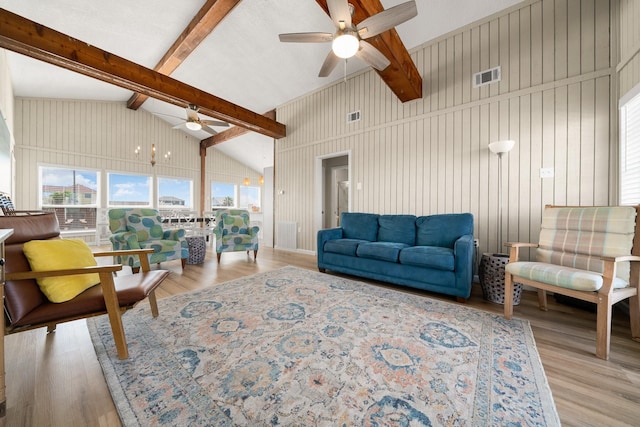 living room with ceiling fan, high vaulted ceiling, beamed ceiling, and light wood-type flooring